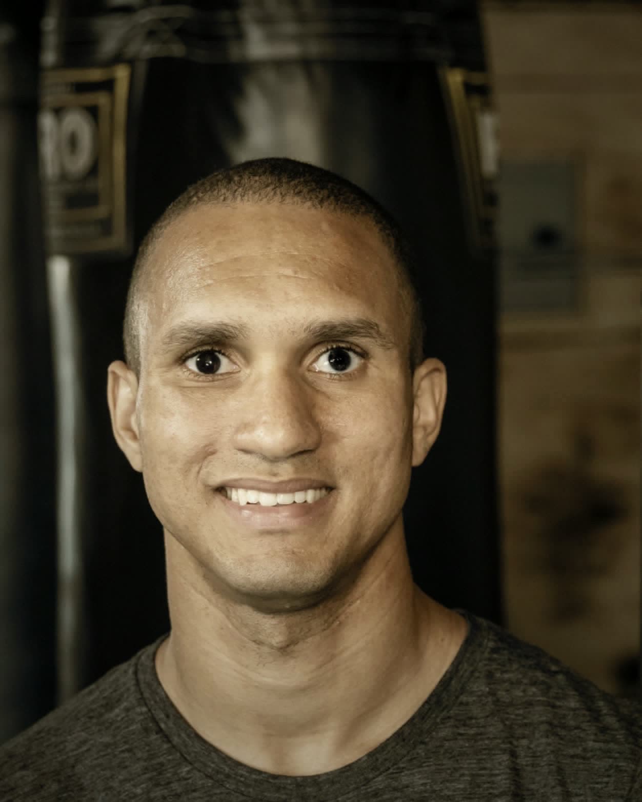 Jordan Muir in front of a heavy bag at JFM Boxing Club